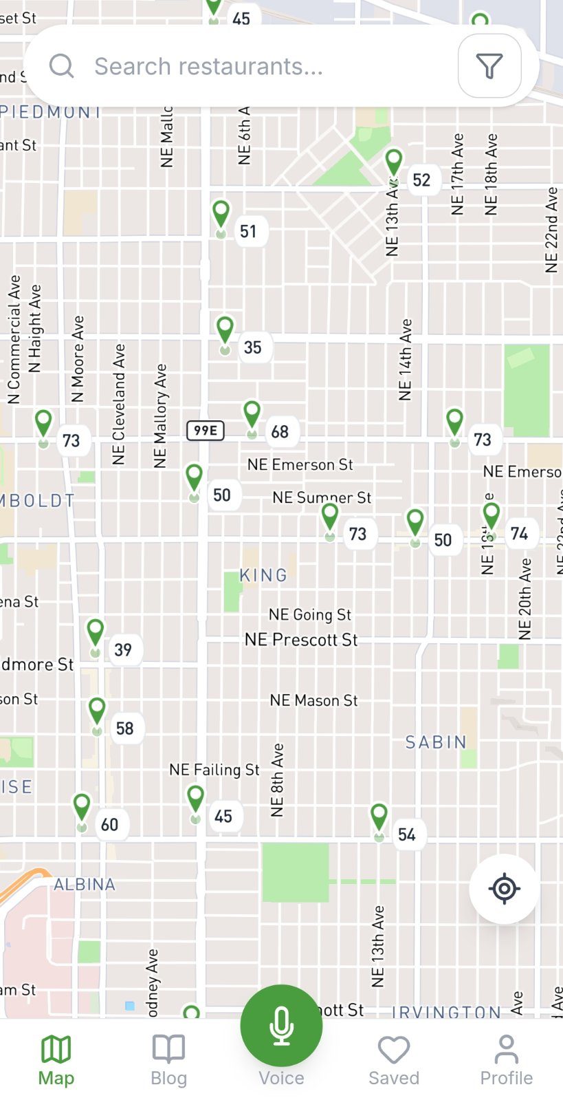 VeganMapAI map of North Portland: restaurant pins labeled with VeganScores from 35 to 74, search bar on top, voice search button below